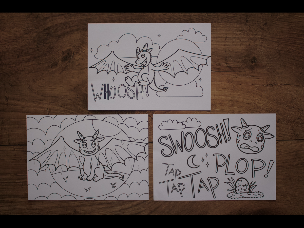 Three black and white dragon coloring pages displayed on a dark wooden background.